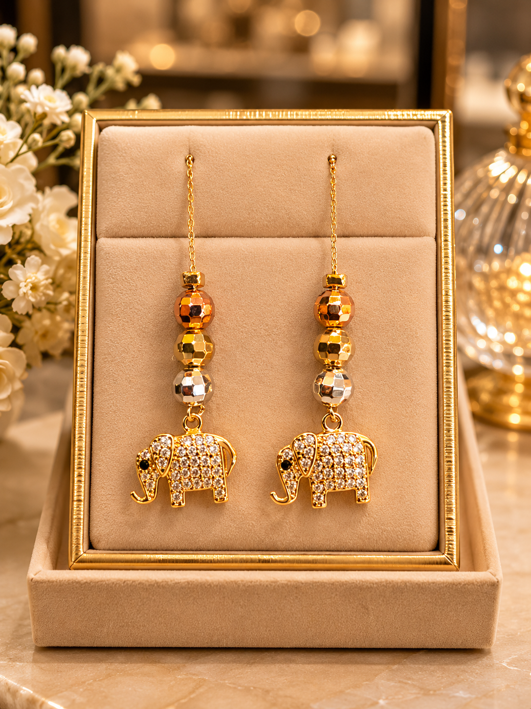 Gold elephant earrings