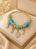 Gold Key & Crystal Heart Charm Bracelet
