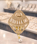 Women gold sari brooch