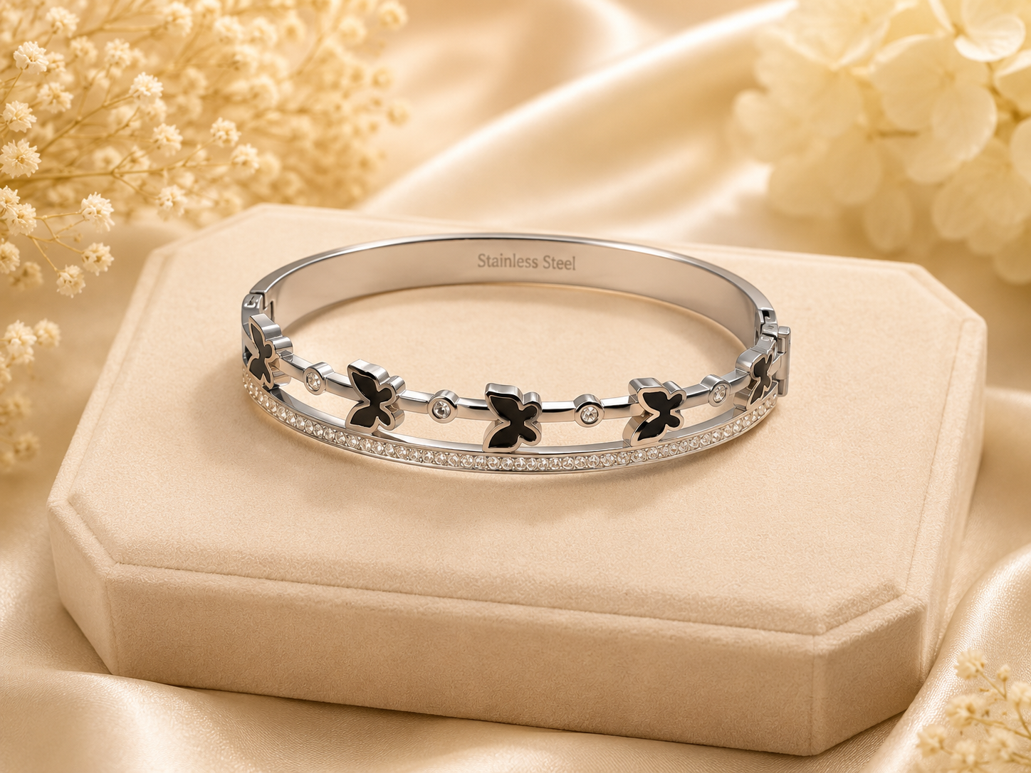 Silver bracelet with black butterfly designs